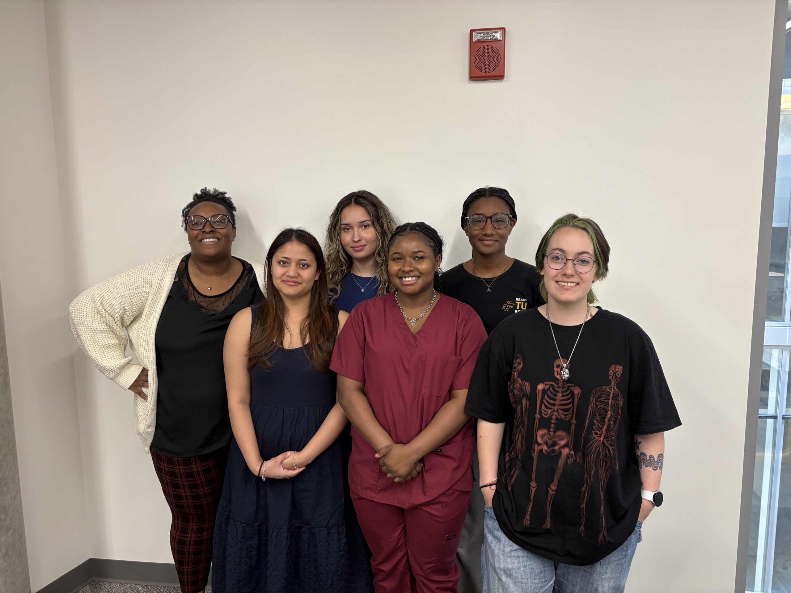 From left to right, front Row: Somika KC, Aria Grizzle, CJ Gaskill Back Row: Kishana Taylor, Iris Guzman-Campos, Amie Yansane